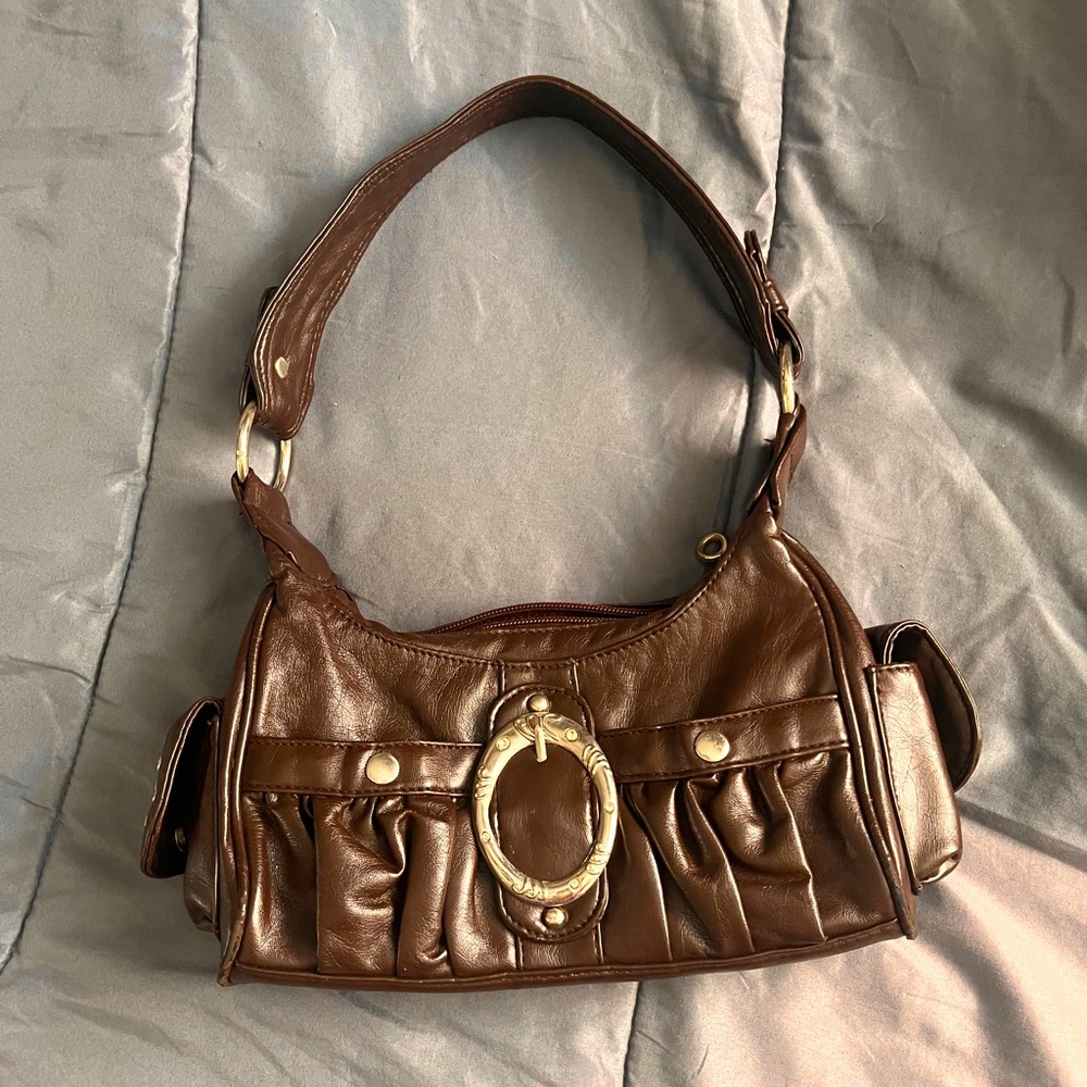 brown belt buckle hand bag
